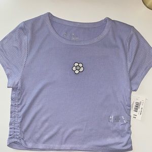 Lavender crop top size L with a flower patch in the front ruched on the side nwt
